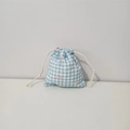 Detail of floral cotton drawstring bag showing blue checkered pattern and pink bows - Blue Plaid