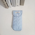 Detail of light blue quilted heart pattern glasses case with white snap button closure - Blue Heart