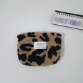 Detail showing plush leopard print fleece texture and white woven label on cosmetic bag - Khaki Large Leopard