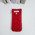 Close-up of red quilted heart pattern fabric with white resin snap button closure - Wine Red Heart