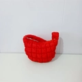 Detail of bright red quilted puffy hobo bag with distinctive square textured padding - Red