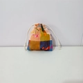 Detail of floral printed cotton drawstring bag with colorful geometric patterns - Checkered Tulip