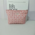 Detail of pink quilted makeup bag featuring red heart patterns and May Rabbit logo - Pink Makeup Bag