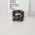 Front view of square leopard print plush pouch with soft faux fur texture and brand label - Grey Leopard Sherpa