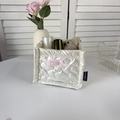 Detail of cream quilted PU storage box featuring embossed hearts and a pink silk bow - Cream White Large Heart