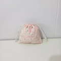 Detail view of pink floral cotton storage pouch with white drawstring closure - Pink Rose