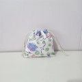 Detail of floral drawstring pouch showing blue flower prints and white cotton cords - Blue Galsang Flower