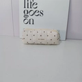 Detailed macro view of beige quilted heart pencil case with fabric May Rabbit label - Beige Pencil Case