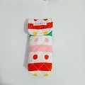 Detail of colorful striped quilted cotton pouch with metal snap button and brand label - Colorful Stripes and Dots