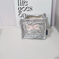 Close-up of silver quilted storage bin featuring heart patterns and pink ribbon bow - Silver Heart