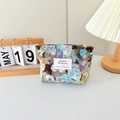 Detail of floral canvas makeup bag with zipper closure on a stylish desk setup - Dragon Chant Flower