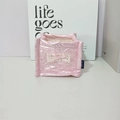 Close-up of pink quilted fabric storage box featuring white lace bow and silk texture - Pink Heart