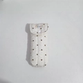Detail of quilted cotton pouch with heart patterns, featuring a snap button and label - Cream White Glasses Bag
