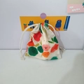 Detail of floral cotton drawstring pouch featuring cute cartoon flower patterns and dual ties - Red and Green Floral