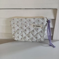 Close-up of quilted floral mini pouch with May Rabbit label and purple wristlet strap - White Base Floral