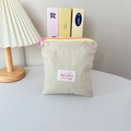 Mini macaron-style makeup bag with yellow zipper detail and cute round pink puller - Vertical Style / Beige