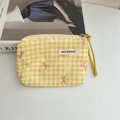 Close-up of yellow checkered cotton coin purse with pink bow pattern and wrist strap - Plaid Yellow Bow