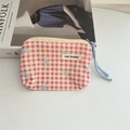 Detail of red checkered floral coin purse with May Rabbit tag and blue cord zipper pull - Plaid Red Bow
