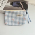 Close-up of blue plaid floral coin purse with zipper and blue woven pull cord - Plaid Blue Bow