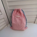 Detail of pink oxford fabric drawstring storage pouch with blue woven cord closure - Pink Large