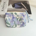 Detail of floral cotton coin purse with drawstring and MAY RABBIT label on white desk - Violet