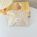 Detail of macaron beige cosmetic pouch with pink zipper and signature logo patch - Horizontal Style / Beige