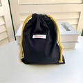Detail of black oxford drawstring pouch with yellow rope and Mayrabbit brand label - Black Medium