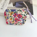Detailed view of floral cotton pouch with purple drawstring and May Rabbit textile label - Colorful Floral