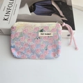 Detail of floral canvas makeup pouch with tulip print and pink drawstring zipper pull - Pink Flower Sea