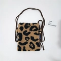 Detail of leopard print plush mini crossbody bag with brown woven rope strap and buckle - Khaki Large Leopard
