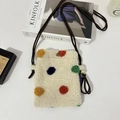 Detail of plush fleece mini crossbody bag with colorful polka dots and rope strap - Colored Polka Dots