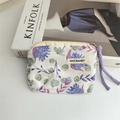 Detail of floral cotton coin purse with zipper closure and woven purple rope handle - Galsang Flower Blue
