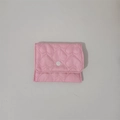 Close-up of pink quilted heart pouch with snap button for jewelry storage - Pink