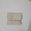 Detailed view of beige heart-quilted coin purse with snap button closure for jewelry - Khaki