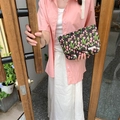 Detail of floral makeup bag with pink tulip print and white brand label on dark fabric - Floral Tulip Black