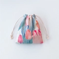 Detail of floral drawstring pouch showing textured fabric and tulip print design - Red Tulip