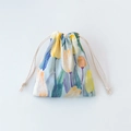 Close-up of floral drawstring storage bag with yellow tulips on light blue cotton fabric - Blue Tulip