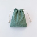 Detail of light green corduroy drawstring storage pouch with soft vintage texture - Grass Green