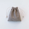 Detail of gray corduroy drawstring bag showing soft ribbed texture and white cotton ropes - Gray