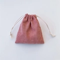 Detailed texture of pink corduroy drawstring storage bag with cotton weave ropes - Lotus Pink