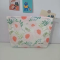 Close-up of the floral makeup bag showing the metal zipper and floral fabric details - Pink Peony