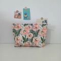 Detailed view of tulip floral pattern cosmetic bag with May Rabbit label in cozy setting - Pink Hibiscus