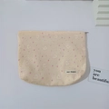 Close-up of May Rabbit beige cosmetic bag with floral rabbit pattern and zipper - Pink Strawberry Rabbit (Corduroy)