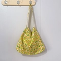Close-up of floral cotton tote bag with yellow tulips hanging on a wooden hook - Small Floral Tulip Yellow