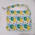 Detail of floral canvas tote bag with yellow and blue daisy patterns on white background - Colorful Flowers