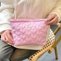 Detail of pink quilted heart cosmetic bag with satin fabric and woven MAY RABBIT label - Pink