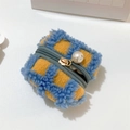 Close-up of blue and yellow waffle plaid plush earphone case with a large pearl pendant - Blue Plaid