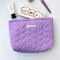 Detail of purple quilted makeup bag with heart pattern and May Rabbit woven label - Purple
