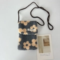 Detail of soft plush crossbody bag with yellow flower pattern and woven shoulder strap - Yellow Flower