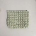 Detailed close-up of mint green popcorn texture fabric on a large makeup wash bag - Light Green